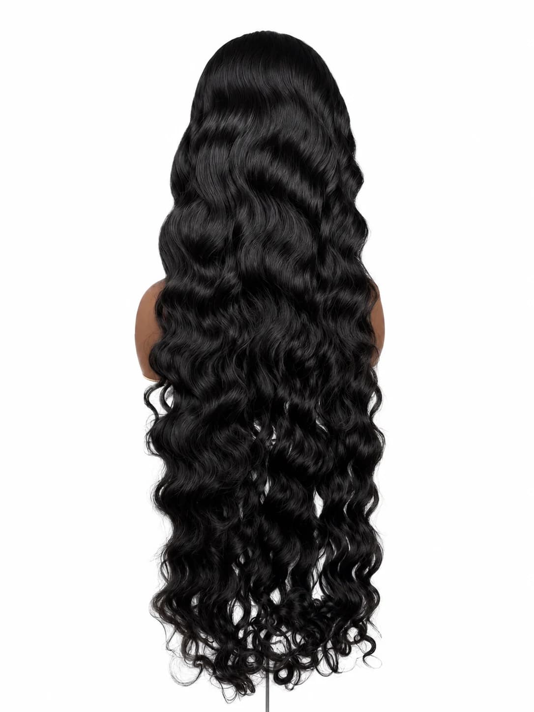 Dark Indian-wavy wig on a clean cream background